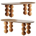 Oval Shaped Wooden Desk Featuring Stacked Brown Pom Pom Legs