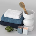 Stacked Colorful Towels Wooden Brush In White Holder With Small Candles And Green Artichoke