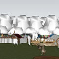 Lush Grassy Outdoor Area With Green Trees White Fence Small Tents And Rabbits