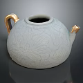 Elegant White Ceramic Teapot With Intricate Floral Patterns Golden Handle And Spout Design