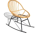 Modern Rattan Outdoor Rocking Chair With Black Metal Frame And Shadow