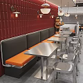 Modern Restaurant Interior With Red Brick Walls Black Orange Booth Seats And Metal Tables Chairs