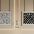 Abstract Paintings With Black And White Patterns Hanging On Beige Wall Frames 3d model