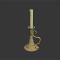 Gold Candle Lamp With White Candle Curved Handle And Round Base On Dark Background