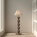 Minimalist Floor Lamp With Twisted Wooden Base And Pleated Fabric Shade In Light Room