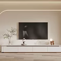 Modern White TV Stand With Wall Mounted TV Green Plants And Decorative Items