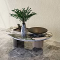Modern Round Marble Coffee Table With Green Plant Vase And Black Bowl On Marble Floor