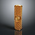 Woman Displaying Elegant Golden Cylindrical Decor With Diamond Pattern And Spiral Design