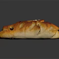 Artisan Braided Bread With Golden Brown Crusty Surface Topped With Sesame Seeds And Raisins