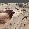 Natural Red Sandstone Rock Arch With Surrounding Desert Vegetation And Landscape