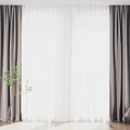 Gray Curtains With White Sheer Panels In Modern Interior With Green Plant And Stool