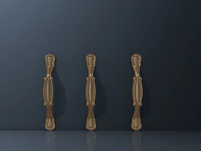 Golden Carved Decorative Handles for Furniture with Intricate Patterns on Dark Surface 3d model