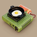 Portable Green Gas Stove with Frying Pan and Fried Egg for Home Kitchen Cooking