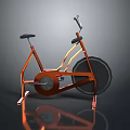 Orange Stationary Bicycle With Modern Metallic Frame Black Seat Large Wheel And Reflective Surface