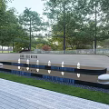Modern Curved Landscape Wall With Water Pool Green Trees And Paved Area Lighting