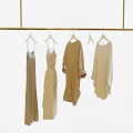 Elegant Dresses For Two Women On Gold Rack