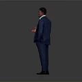 Man in Gray Suit Holding Red Object Standing Against Gray Background