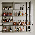 Various Wine Bottles And Glasses Arranged On Modern Shelves With Stylish Design