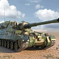 Camouflage Armored Tank With Long Barrel On Desert Terrain Under Blue Sky
