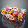 Ferrero Rocher Chocolate in Transparent Box with Multiple Golden Wrapped Balls and Orange Accents