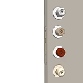 Various Metal Door Knobs in Different Tones on Light Gray Door Panel