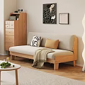 Two Seater Beige Sofa With Wooden Frame Black White Brown Pillows Throw Blanket And Wooden Floor