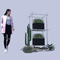 Multi Tiered White Metal Frame Garden Decor with Black Planters Green Plants and Decorative Stones