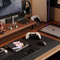 Entertainment Room With Computer Monitor Headphones Game Controller Laptop Game Console And Small Figurines
