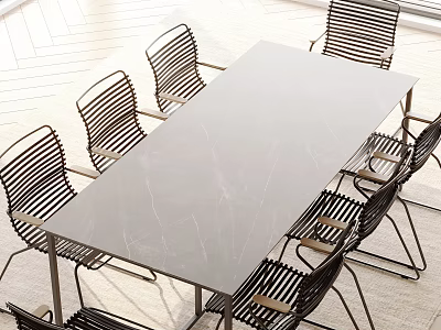 Modern Outdoor Table With Marble Top And Black Woven Chairs For Patio Area 3d model