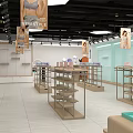 MJ Clothing Store Modern Interior With Fashion Apparel Mannequins And Bright Lighting