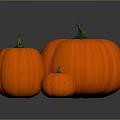 Fresh Orange Pumpkins of Various Sizes with Green Stems Displayed on Gray Surface
