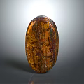 Wooden Stone Decorative Object With Oval Shape Polished Surface Textured Amber Brown Glossy Finish