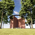 Red Brick Scenic Wall With Perforated Design Surrounded by Green Trees and Blue Sky