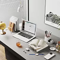 Organized Home Office Desk Setup With Laptop Open Book Globe And Plant