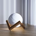 Modern White Spherical Table Lamp With Cracked Surface Wooden V Shaped Base And Natural Light