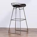 Modern Bar Stool With Metal Frame And Black Seat In Wooden Floor Interior