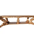 Luxurious Golden Dining Table With Ornate Carved Legs And Intricate Details