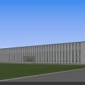 Modern Industrial Factory Building With Many Windows Green Lawn And Front Road Under Blue Sky