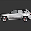 Silver Jeep SUV With Sporty Design Black Wheels Red Brake Calipers And Roof Rack