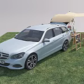 Outdoor Table Setup For Camping With Canopy Car Chairs And Decorative Items On Grass