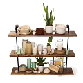 Three Tier Wooden Plant Stand With Green Plants Bowls Jars And Baskets