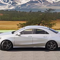 Silver Mercedes Car With Sleek Exterior On Mountain Road Scenic Background