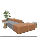 Modern Public Seating With Orange Gray Cushions Green Plant And Side Tables