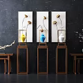 Stylish Console Table Display With Decorative Paintings And Colorful Vases On Wooden Stands