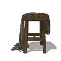 Rustic Wooden Stool With Textured Seat And Draped Fringed Blanket