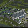 Modern Industrial Factory Complex With Green Roofs Surrounded By Trees And Roads
