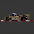 Gold March 761 Race Car With Number 55 Driver And Red White Barriers