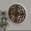 Elegant Circular Carved Window Decoration With Intricate Wooden Patterns And Green Plant