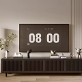 Modern Black TV Stand with Slatted Doors and Decorative Vase Sculptures on Light Wall Background