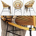 Round Wicker Rattan Chair With Knitted Blanket And Black Metal Legs